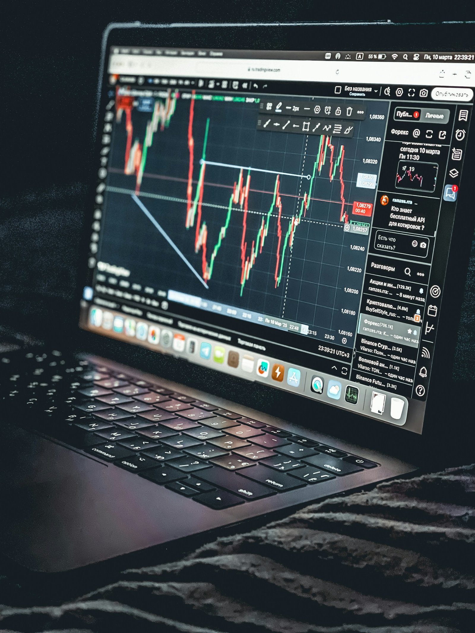Laptop displaying an investment market chart, representing a first long-term investment